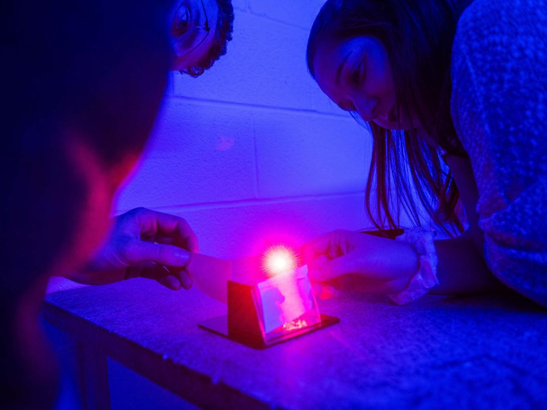 Physics Hologram Lab with students observing the demonstration.