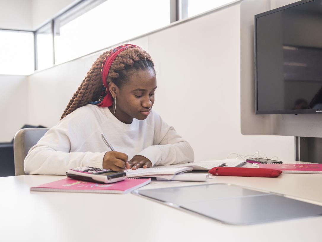 Student studying her class notes.