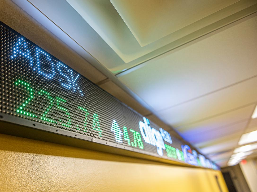 Close up of the stock market ticker tape.
