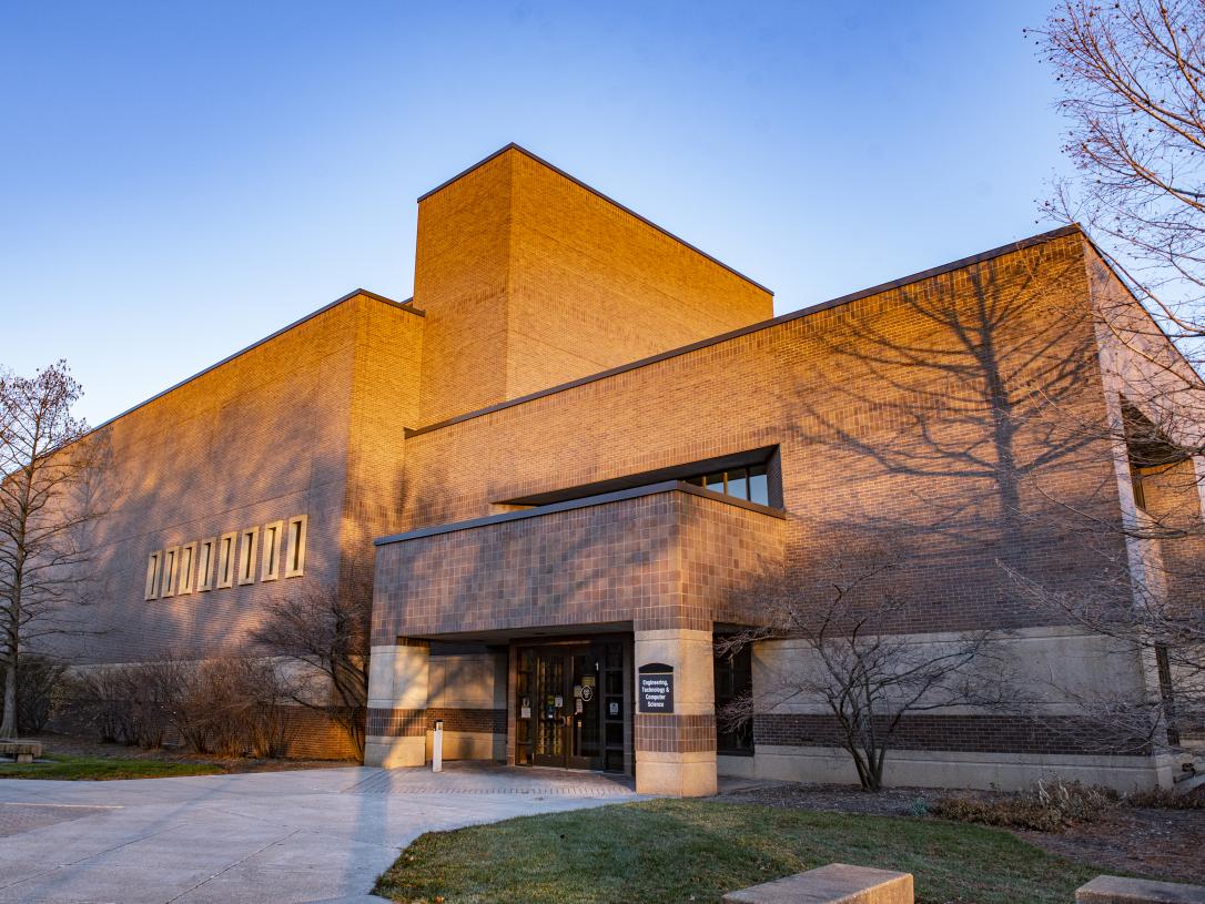 Entrance to the Engineering, Technology, and Computer Science building on an autumn day.
