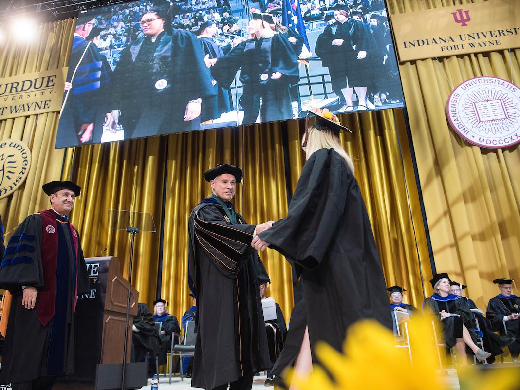 Chancellor Elsenbaumer greets a graduate