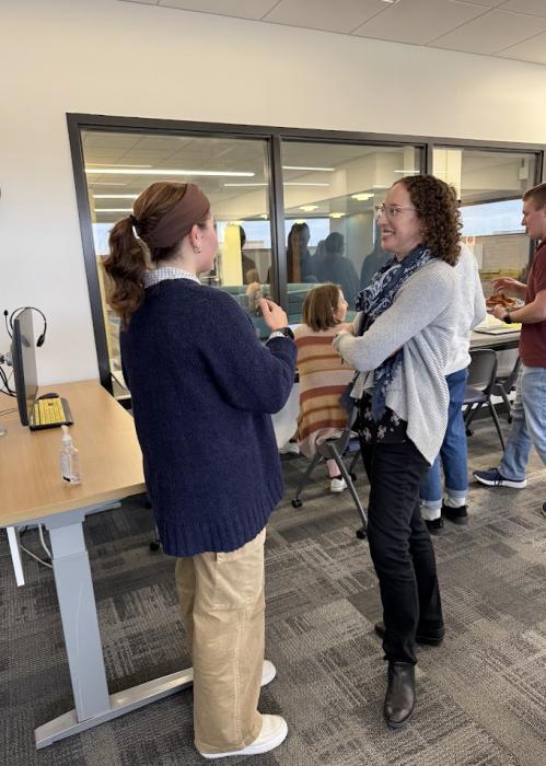 Dr. Bauer has a discussion with a student after a CO-LAB lecture.