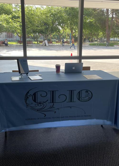 Table with Clio-branded tablecloth