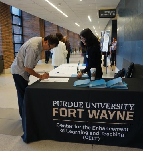 Faculty member signing in at the Annual CELT Fall Teaching Conference