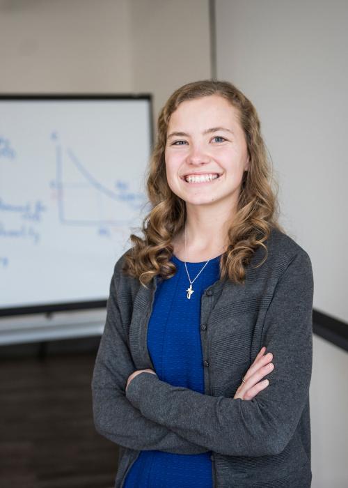Female business student posing indoors.