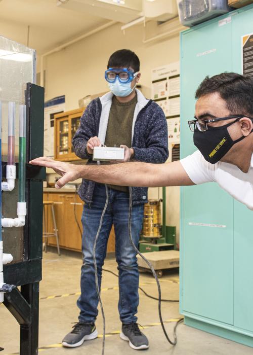 ETCS faculty and student in a Civil Engineering lab