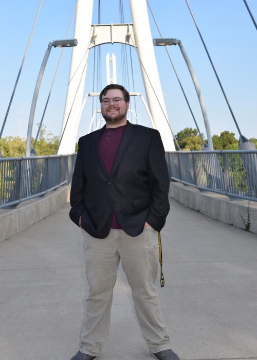 Jacob Billman on a bridge on campus.