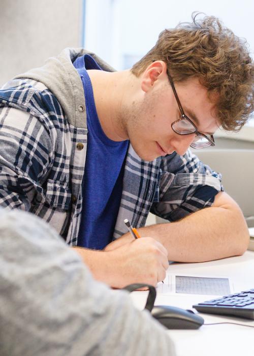 Students working on notes in Jeff Malanson's history class.