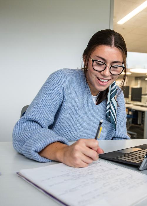 A student studies in the library.