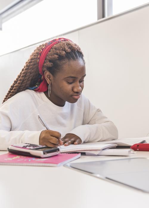 Student studying her class notes.