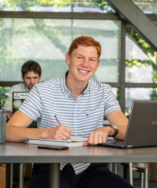 Male business student posing indoors.