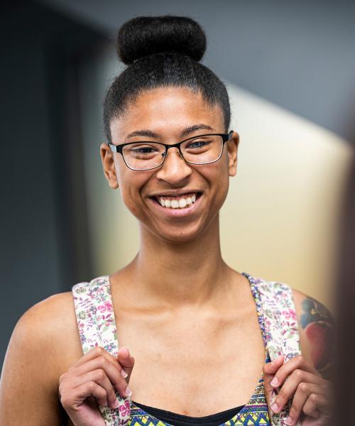 A woman smiling at a friend