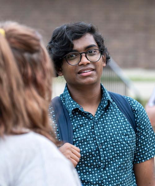 Diverse students gather outside Walb Union