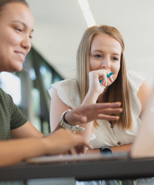 Female students studying indoors.