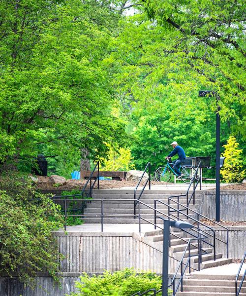 A student riding bike on campus