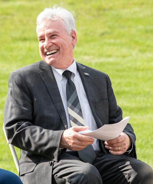 MarTeze and Chancellor Elsenbaumer laugh during the lavender graduation event.
