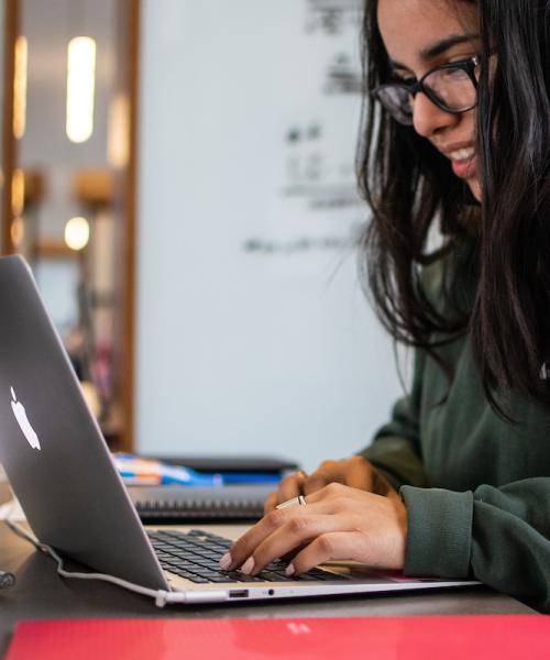 A student works on a laptop.