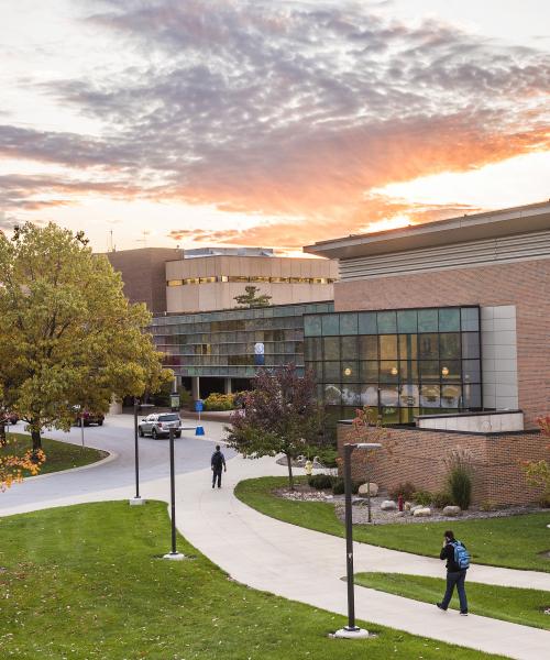 Campus sunset over walb union, helmke library, and the skybridge connecting the two buildings.
