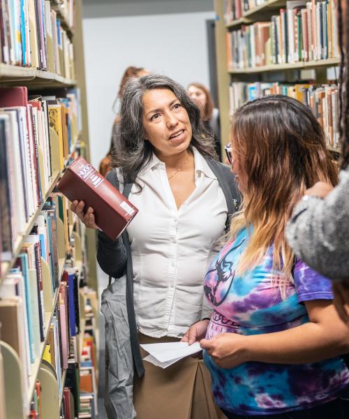 Dr. Nunez gives a library tour to education students