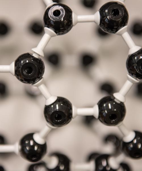 Close up photo of a chemistry framework of atoms connected together.