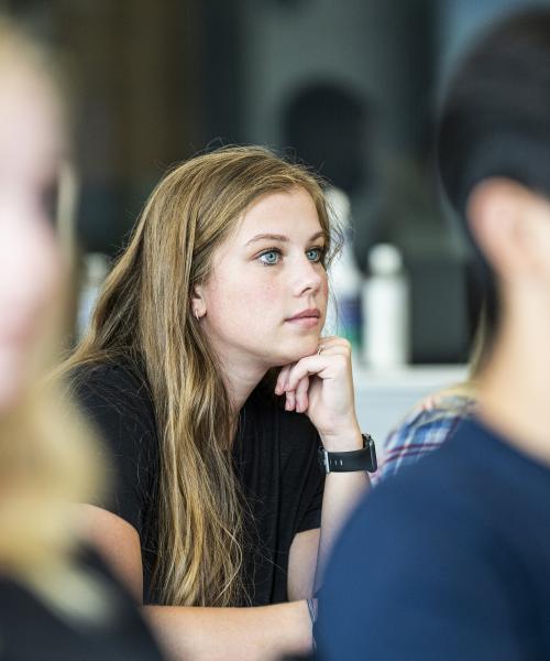 Student listening to lecture.