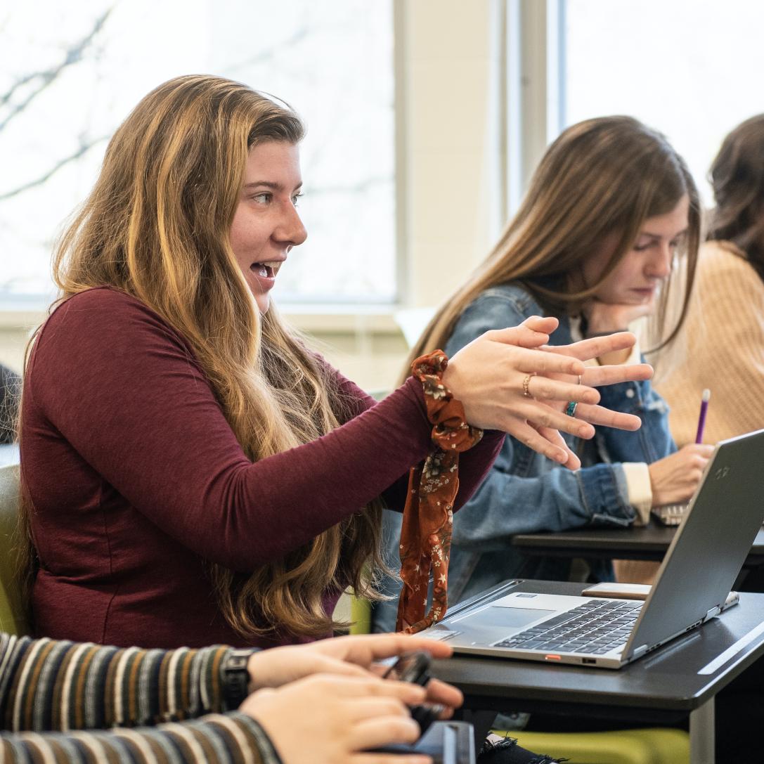 Student discusses a topic in ethics class.