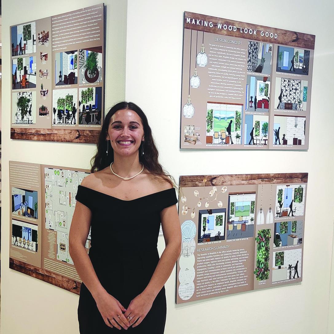 Student in front of Interior Design Project