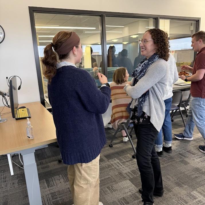 Dr. Bauer has a discussion with a student after a CO-LAB lecture.