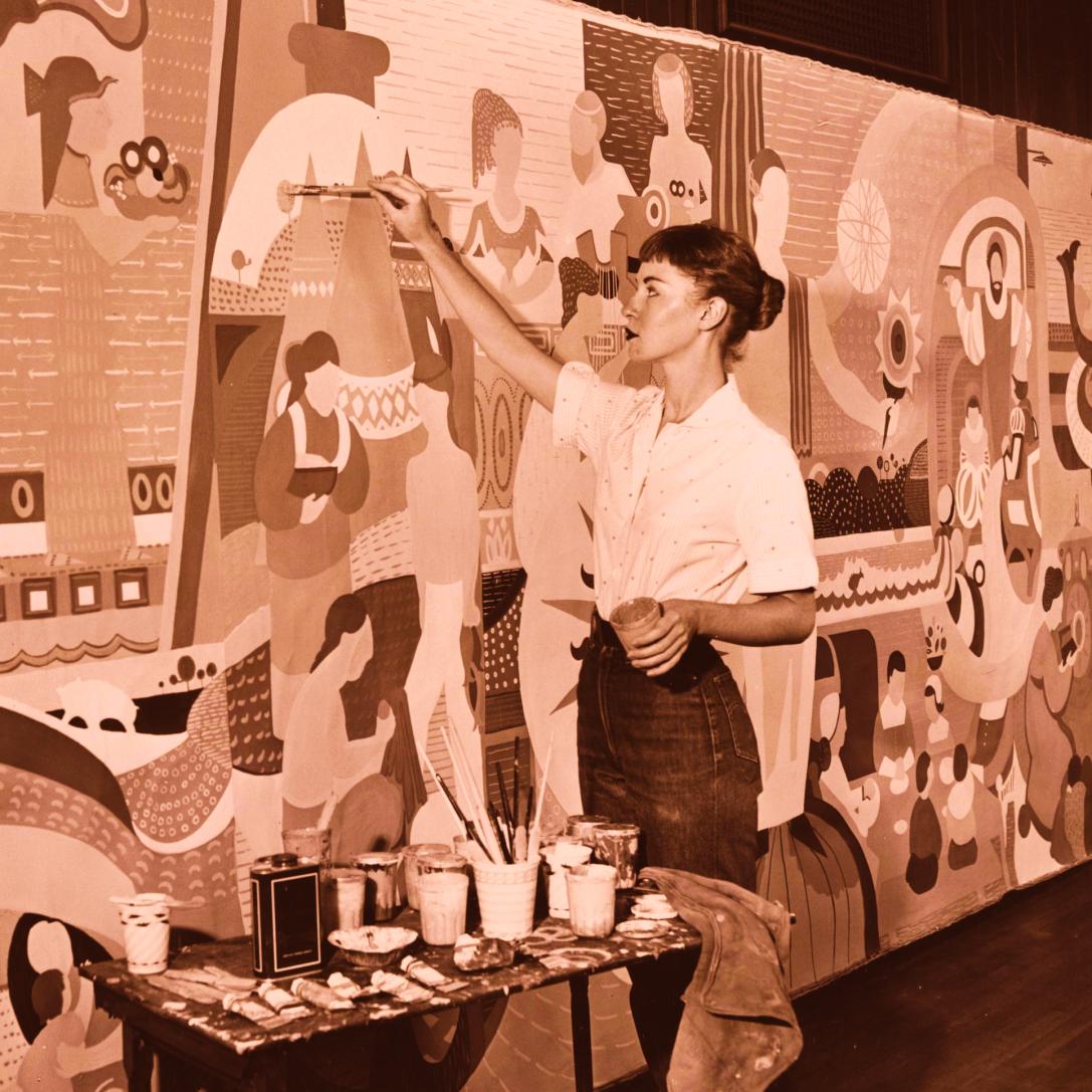 Carol Garcia Painting a Mural