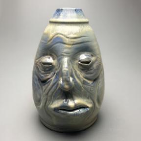 Ceramic pot that looks like a face, by artist Ian Knott