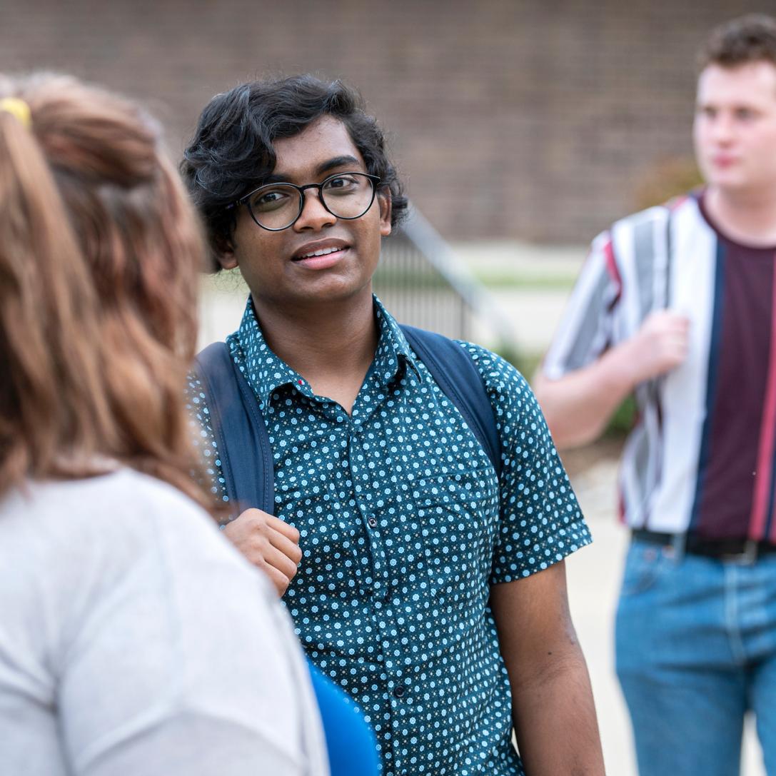 Diverse students gather outside Walb Union