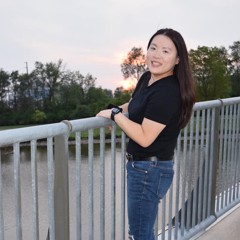Carolyn Pang on the bridge on campus