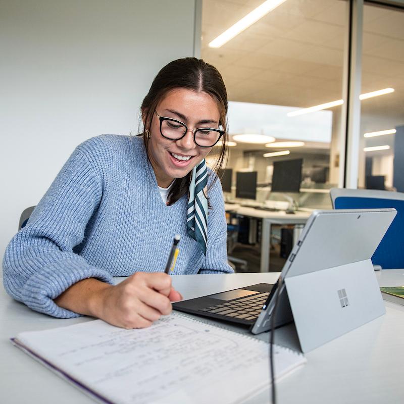 A student studies in the library.