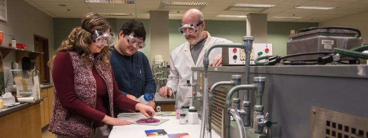 Students and professor in lab
