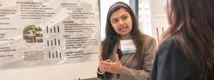 A student presents research.