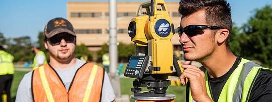 Students from the School of Polytechnic use surveying equipment on the Science Mall.
