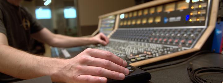 Student using music tech in the Sweetwater facility.
