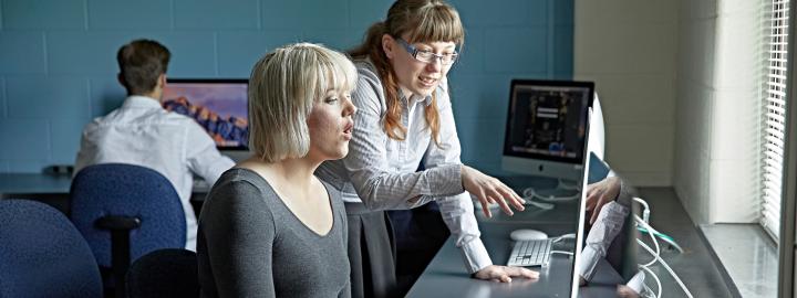 Student and professor at a computer