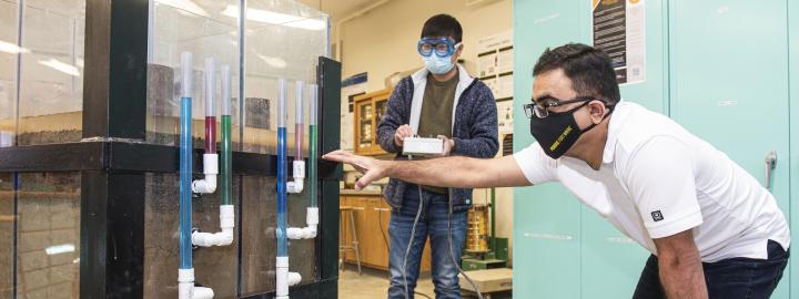 ETCS faculty and student in a Civil Engineering lab