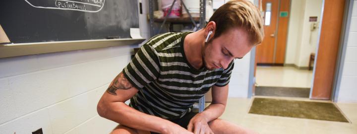 Student spinning a pot