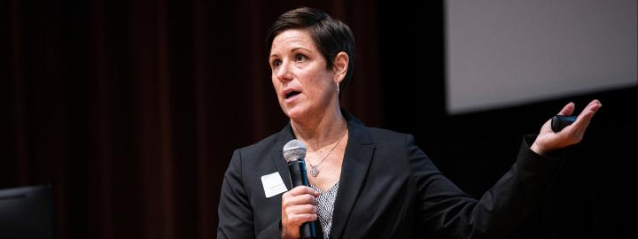 Stacey Hartman speaks at a criminal justice symposium event on campus.