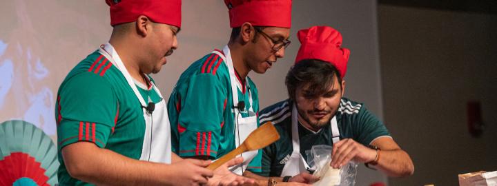 Students cooking on stage