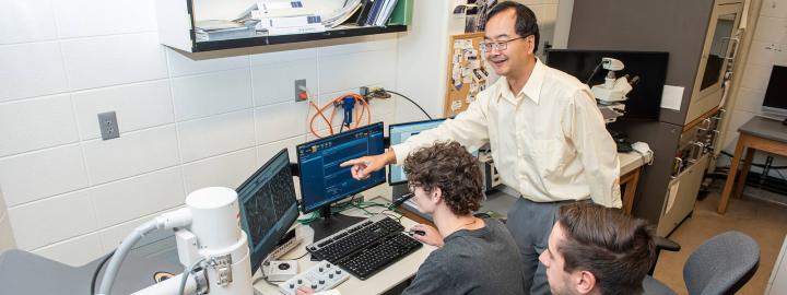 Dong Chen instructs students in the SEM Lab