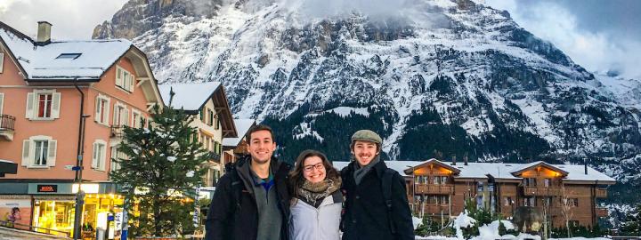 Students standing in front of a mountain