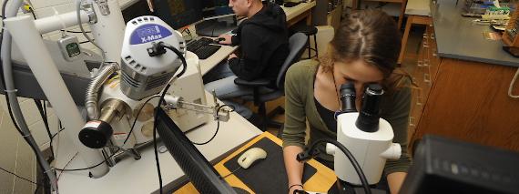 Students using electron microscope