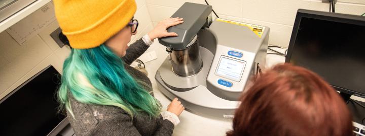 Students using coating machine