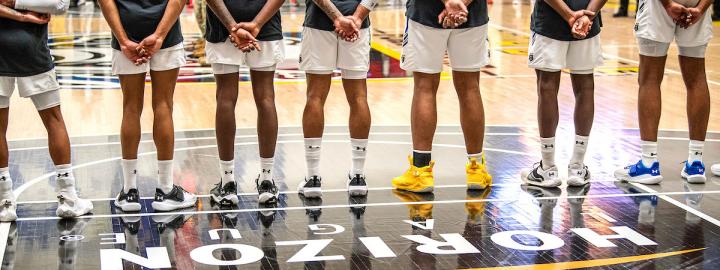 Basketball team lined up at the free throw line