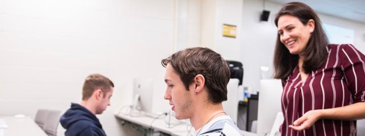 Faculty member teaching a communication class