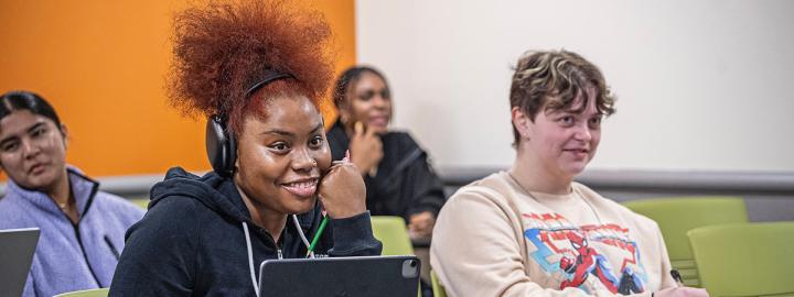 Smiling students in a classroom setting