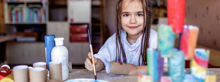 Girl Creating Art out of Recycled Objects
